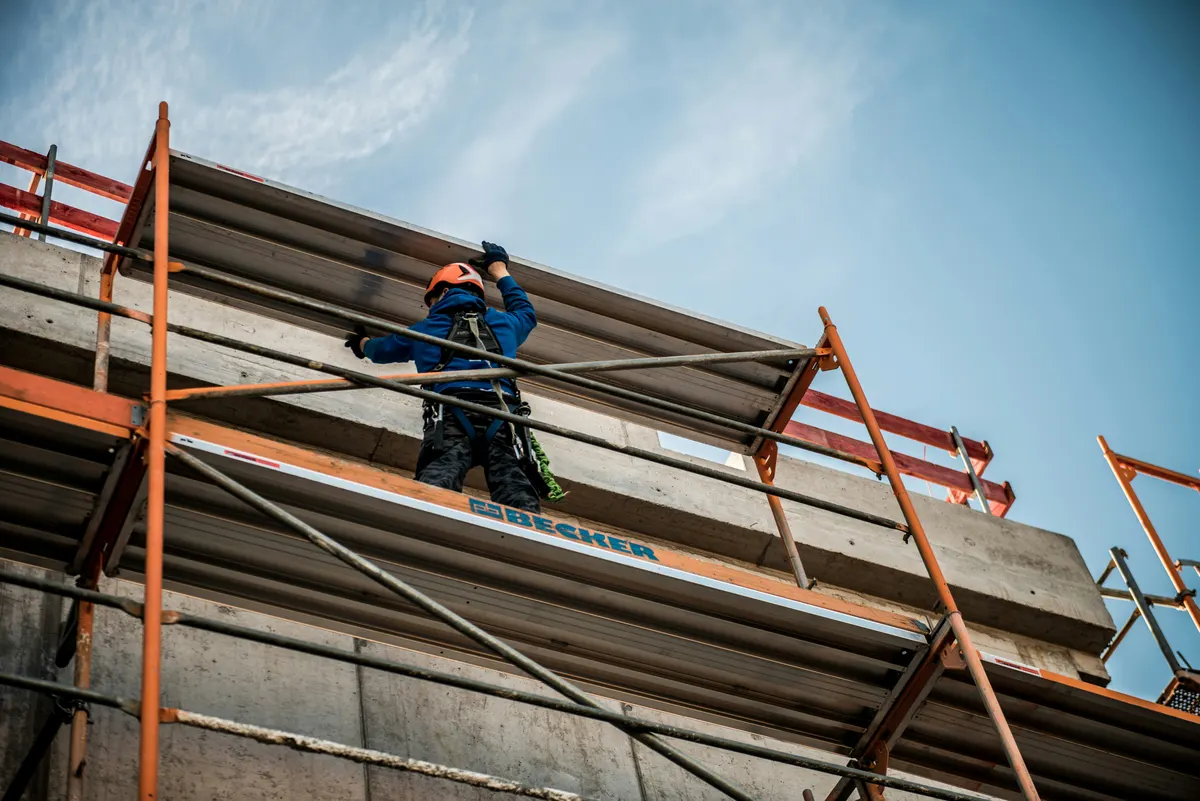Scaffolding contractor preparing an invoice for scaffold hire and erection work
