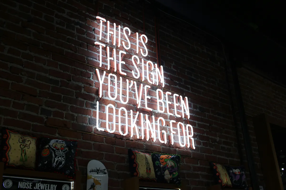 Sign maker preparing custom signage and customer invoice details
