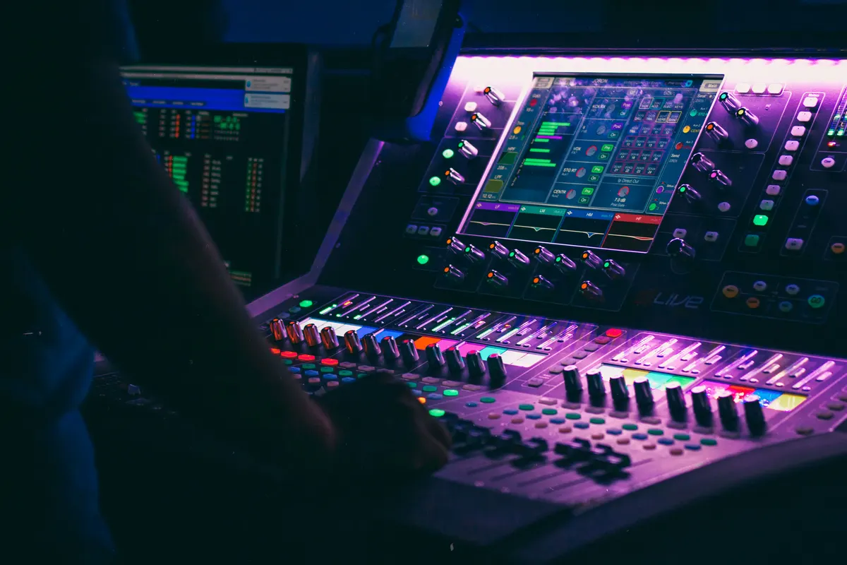 Sound engineer working with professional audio equipment and preparing an invoice