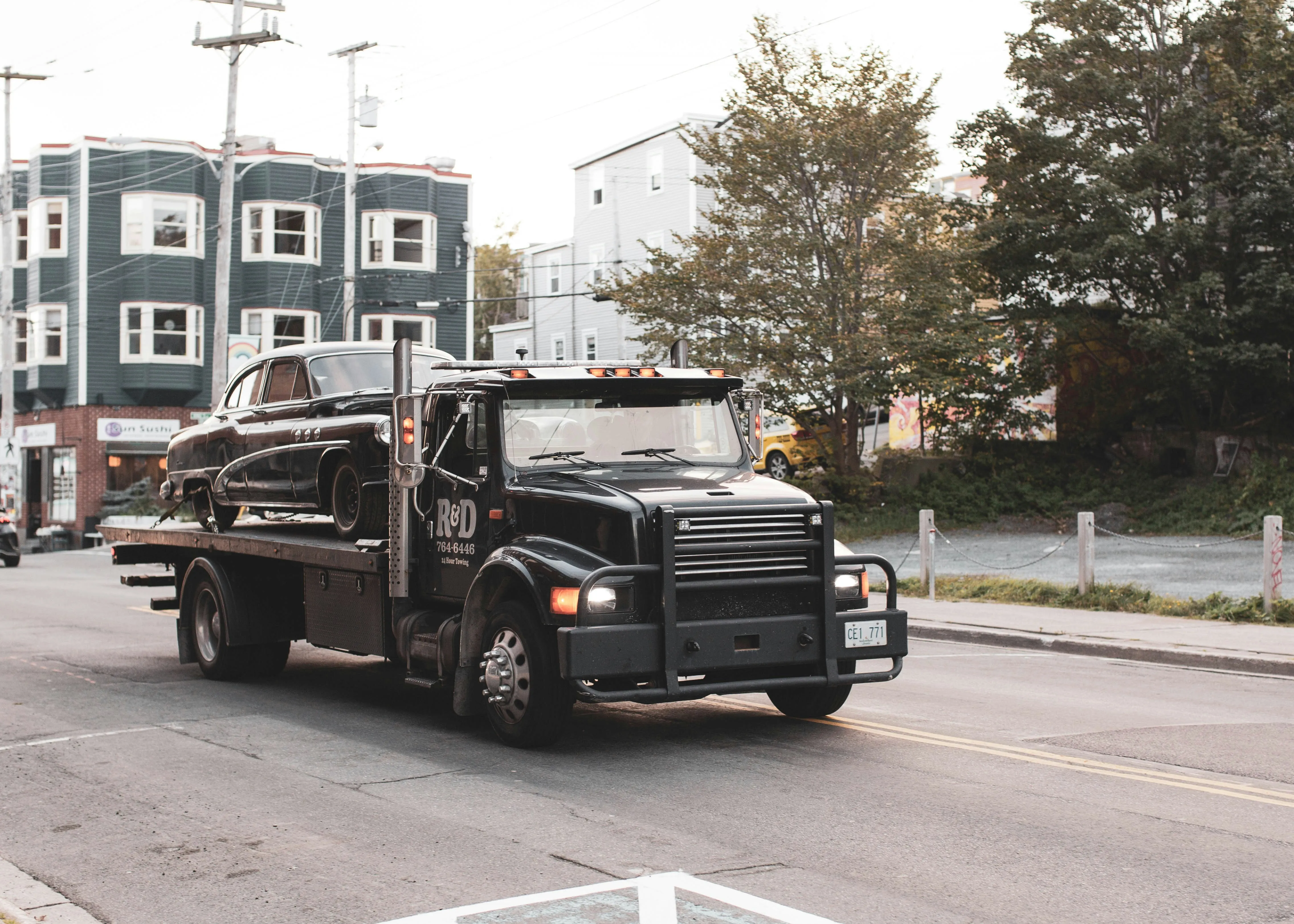 Tow truck operator preparing a towing invoice template for customer billing