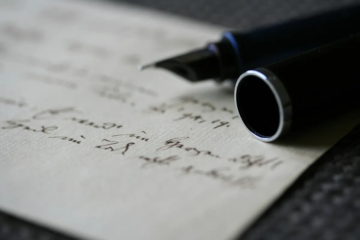 Transcriptionist working on audio transcription and preparing a client invoice