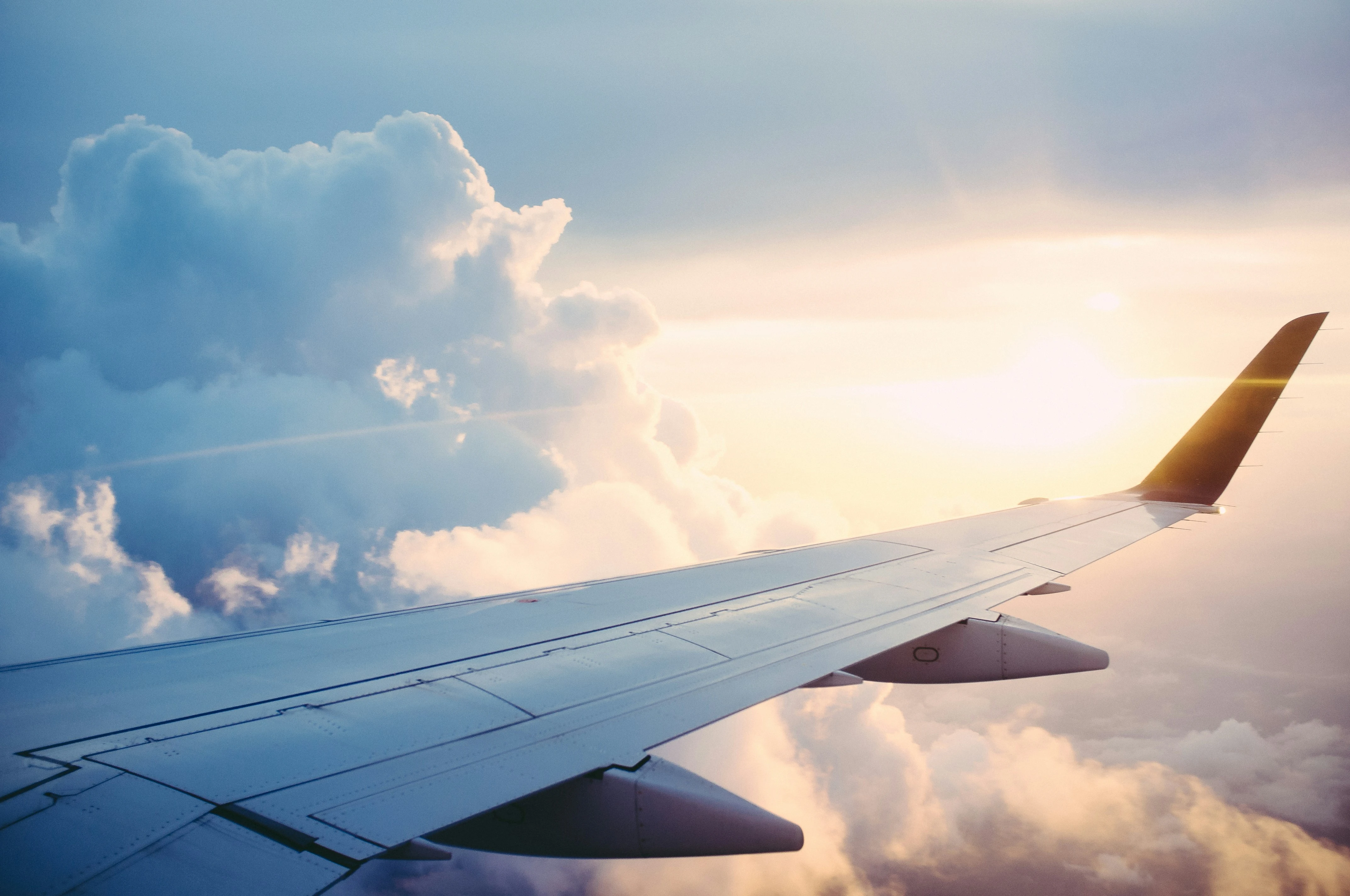 Travel agent preparing a travel agency invoice for holiday bookings