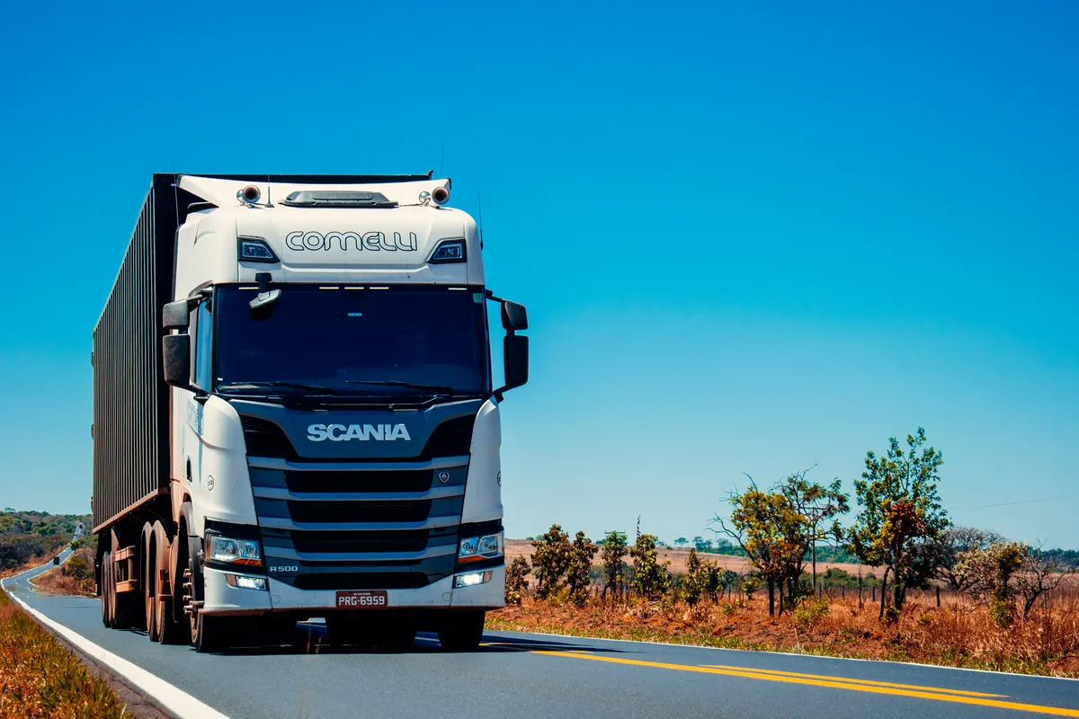 Truck driver preparing a trucking invoice for freight transportation