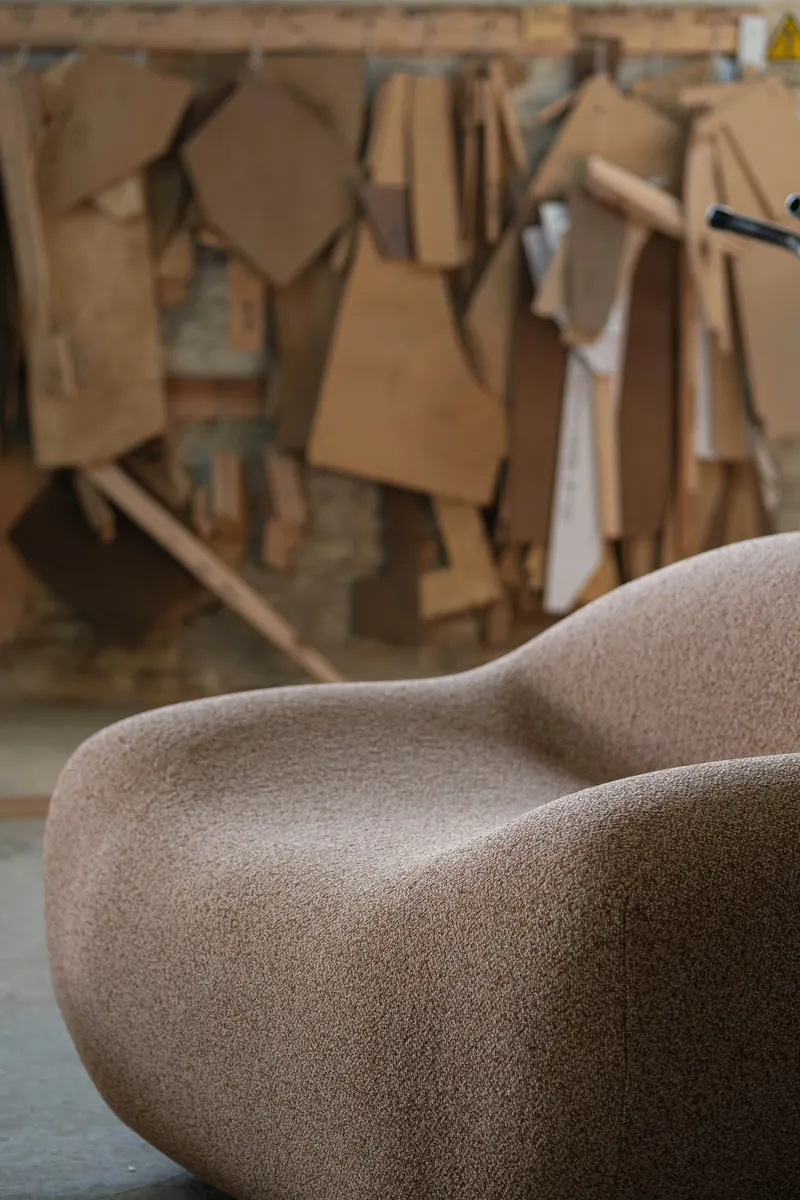 Furniture upholsterer completing an editable invoice for repair work