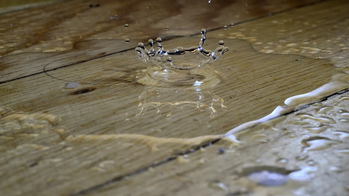 Water damage restoration contractor preparing an invoice after property restoration work
