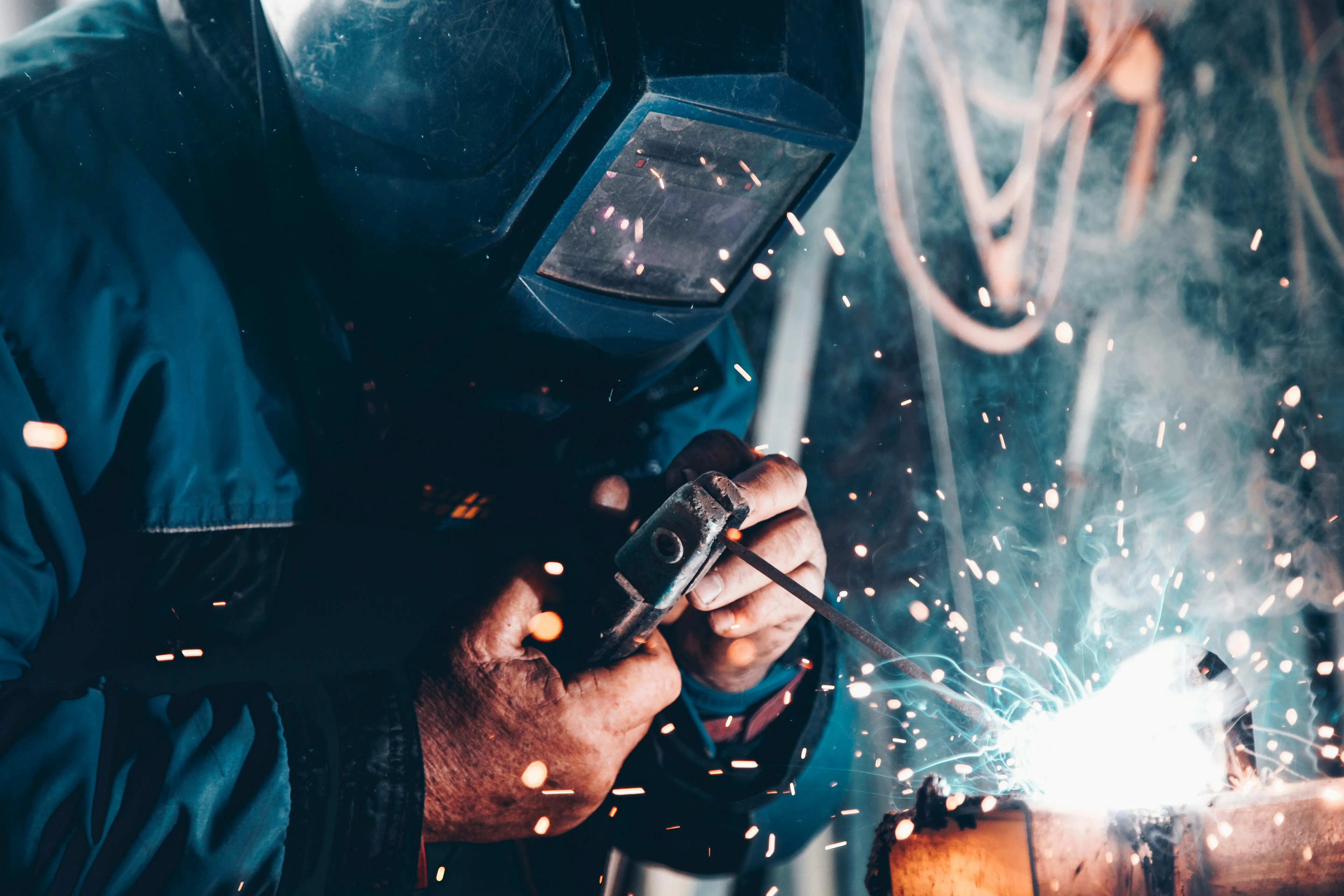 Welder preparing a welding invoice template for fabrication and welding services