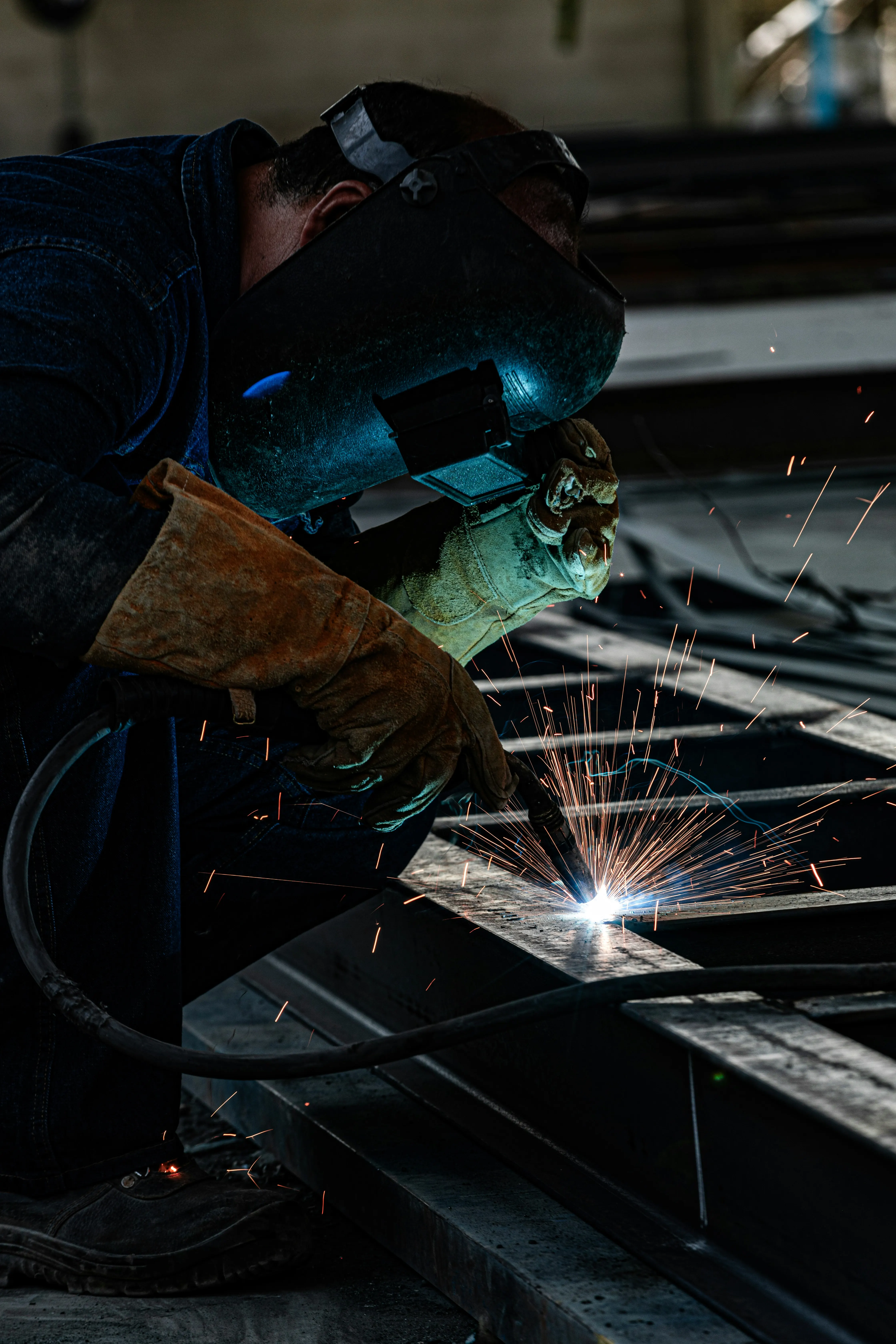 Welder reviewing welding invoice examples and fabrication project billing