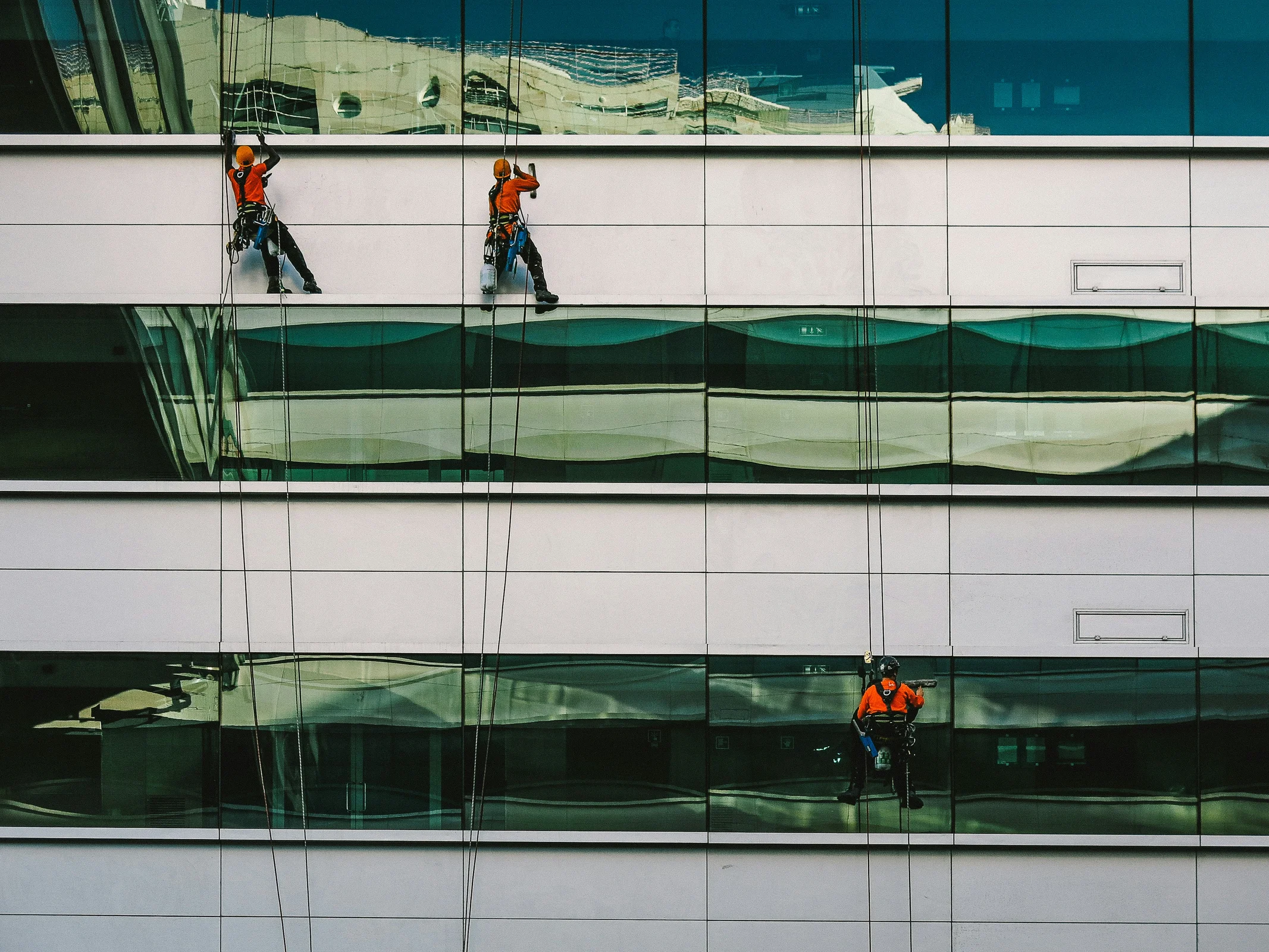 Window cleaner preparing an invoice after completing a cleaning job