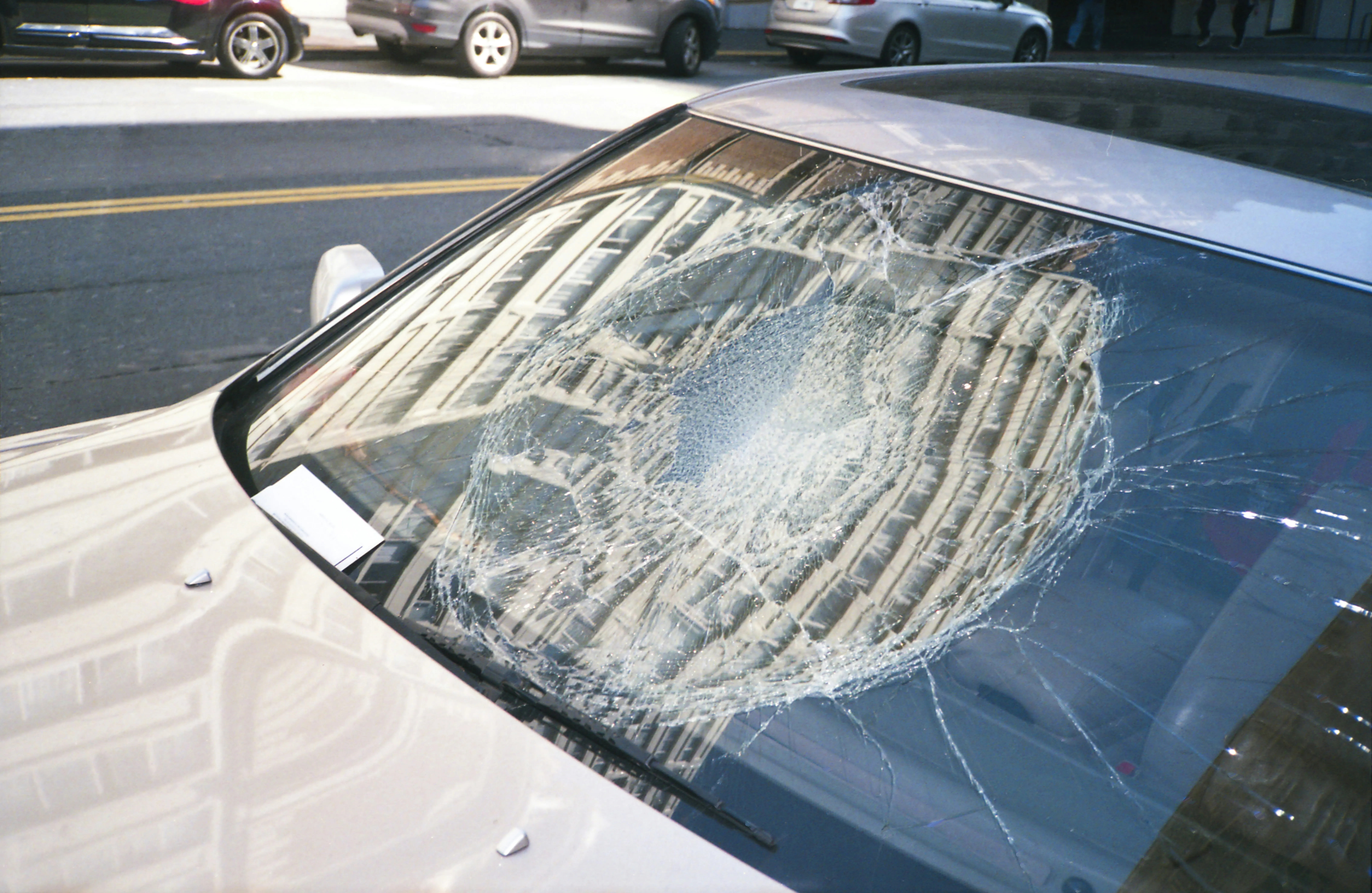 Auto glass technician preparing a windshield repair invoice